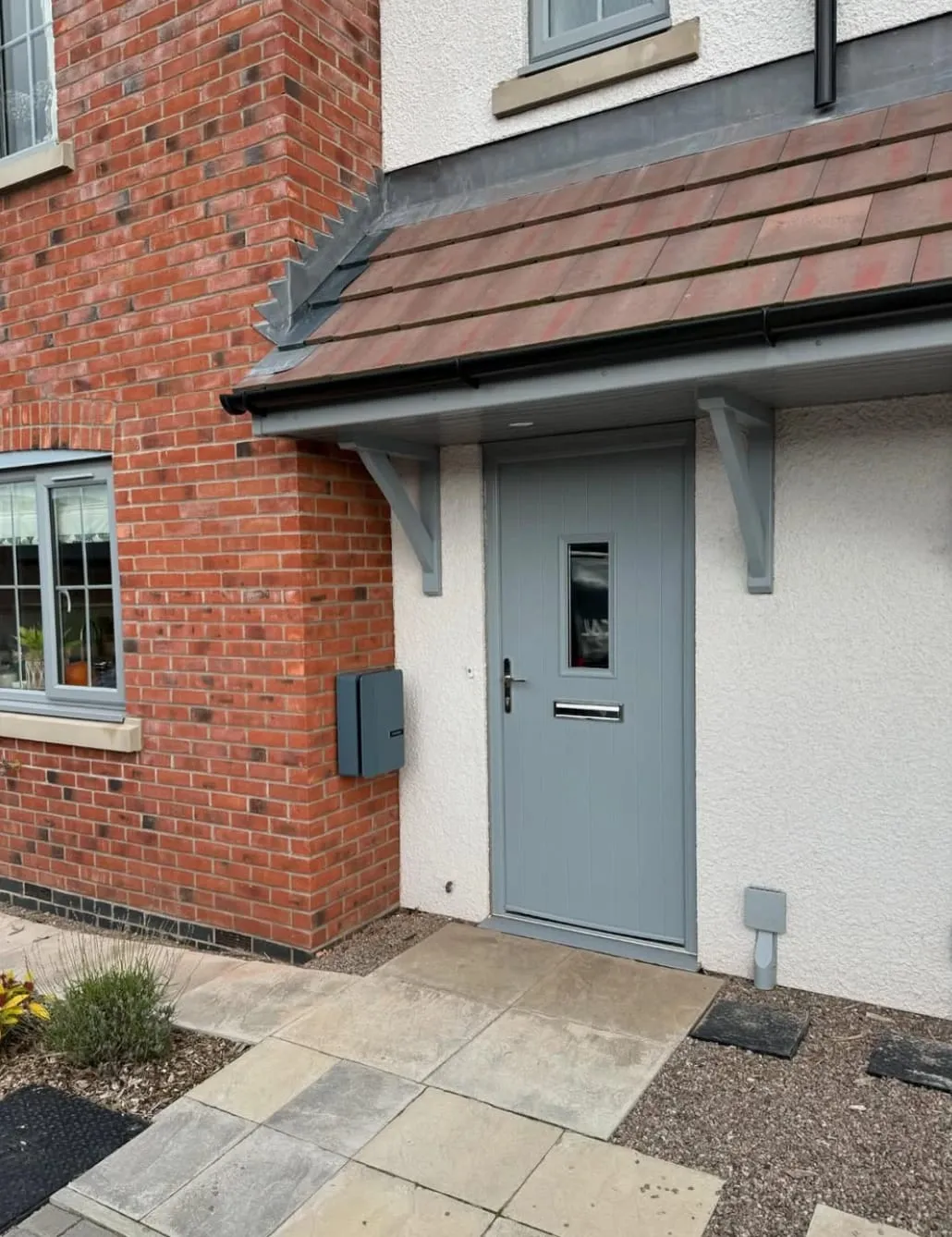 Grey Andersen EV charger installed beside the front door of a new-build home in Leominster