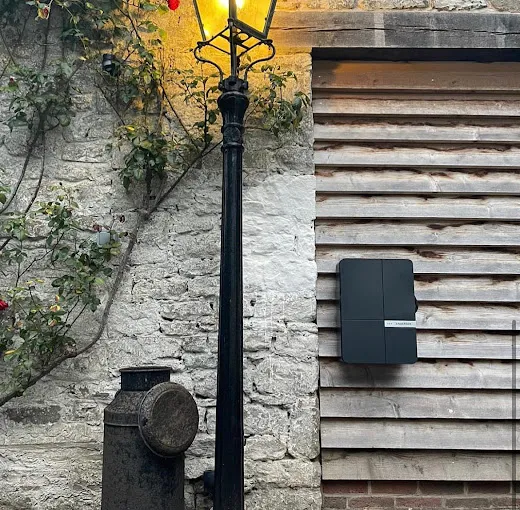 EV charge point installed on a stone wall in Herefordshire
