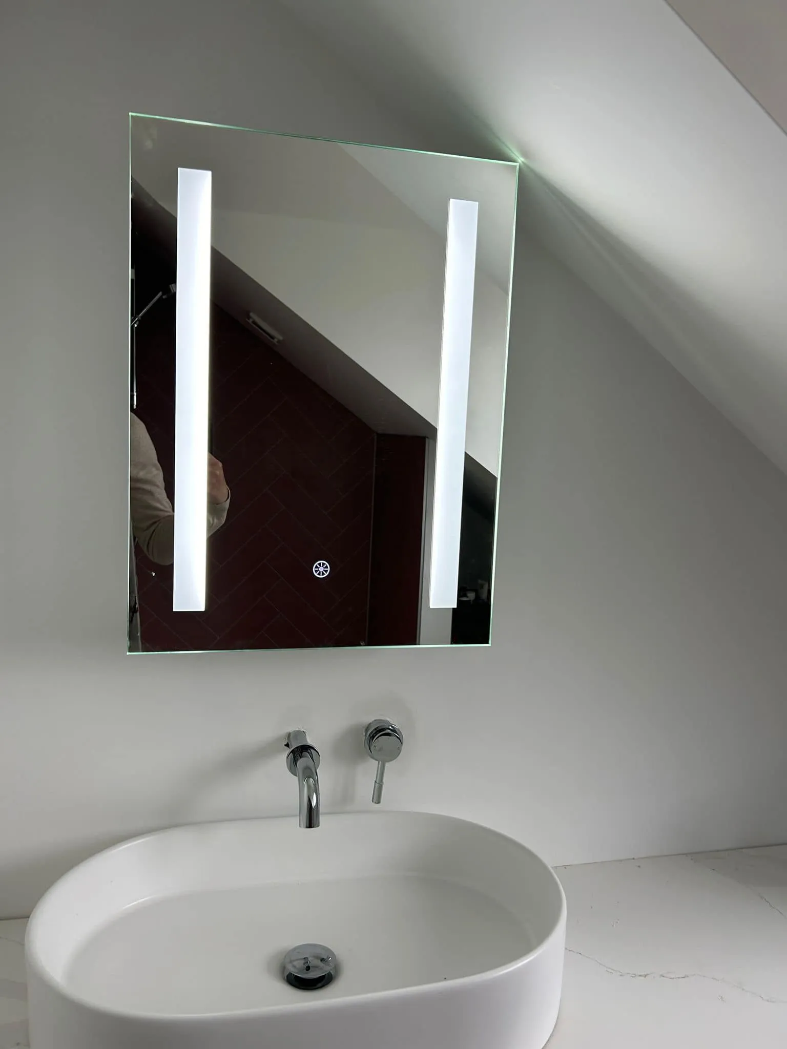 Backlit LED mirror installed in a Hereford bathroom