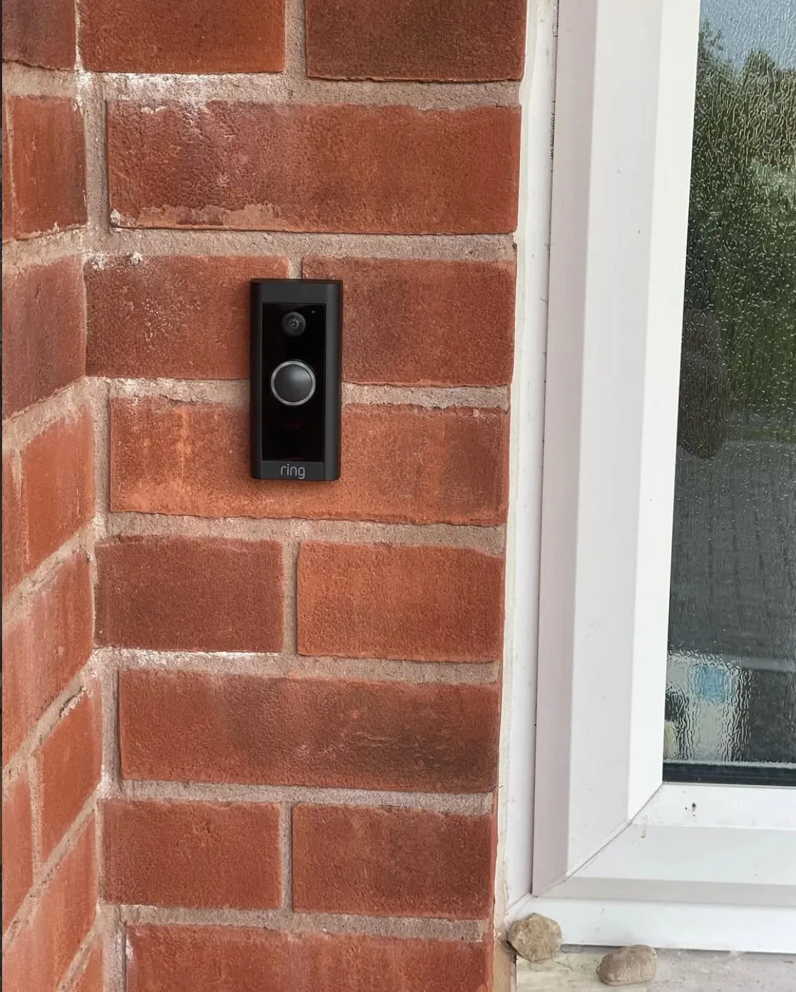 Wired Ring video doorbell installed on a brick porch pillar in Ledbury